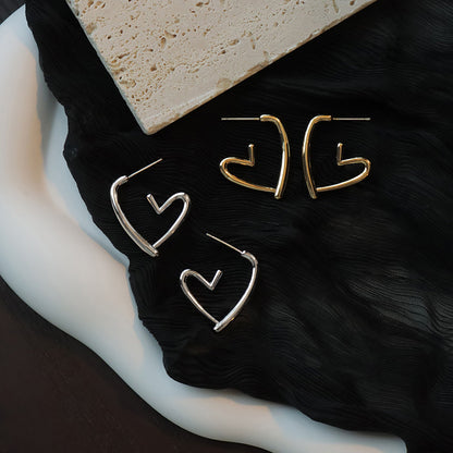 Hollow heart stud earrings